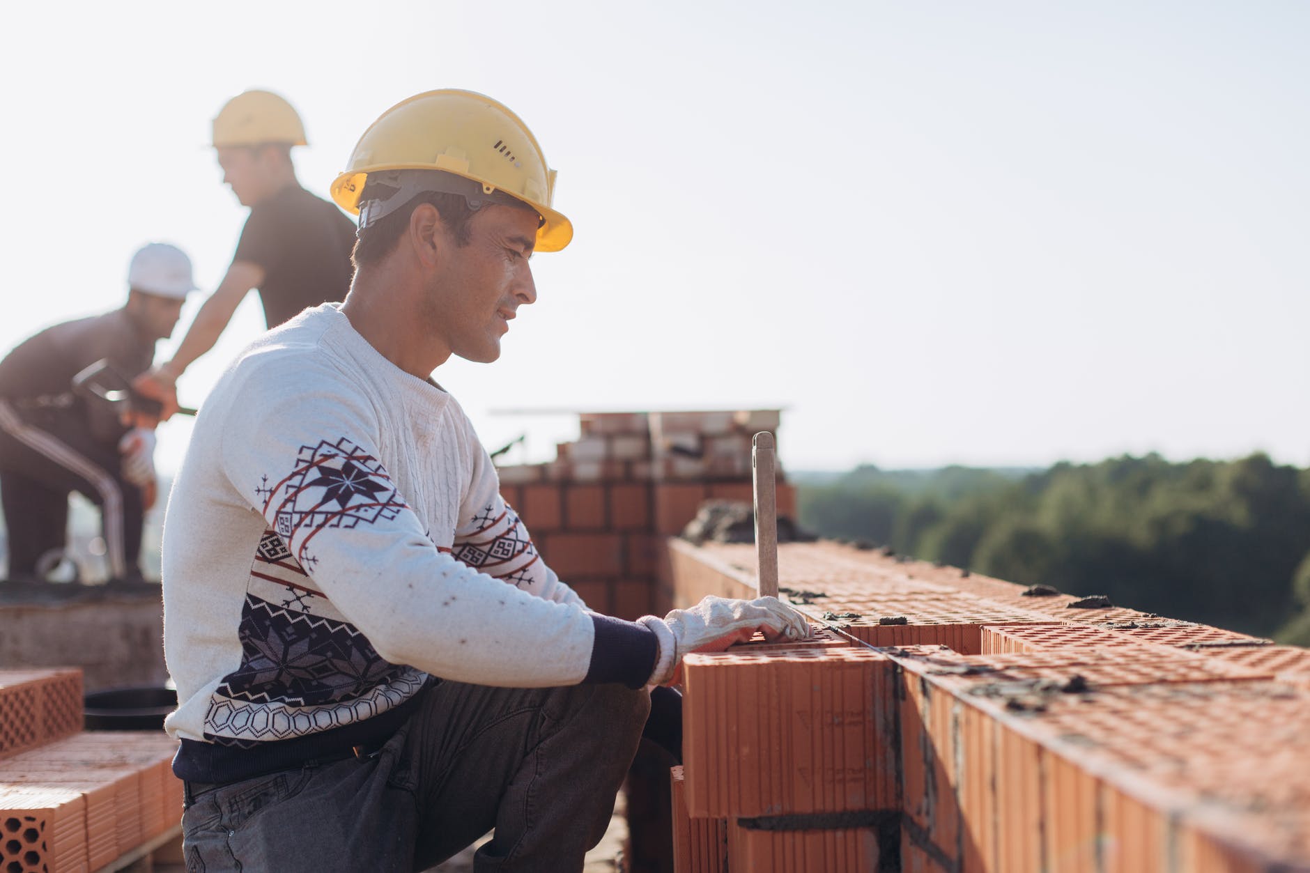 brick workers at construction site