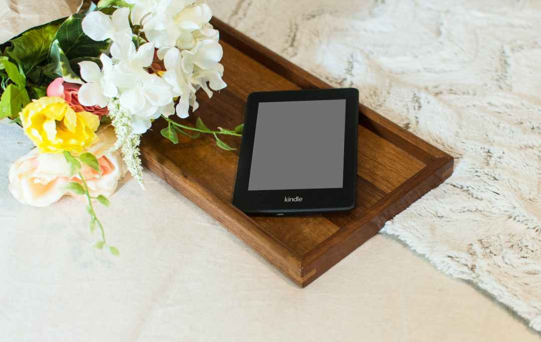 black tablet on wooden tray
